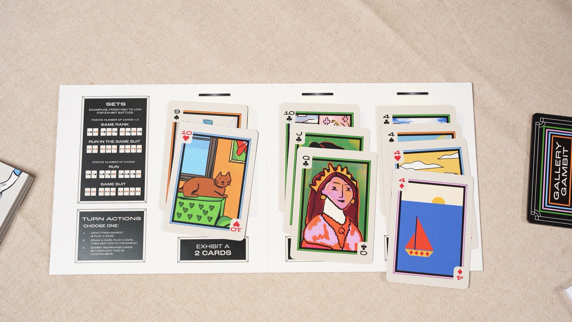 A player board with three completed exhibits fanned out